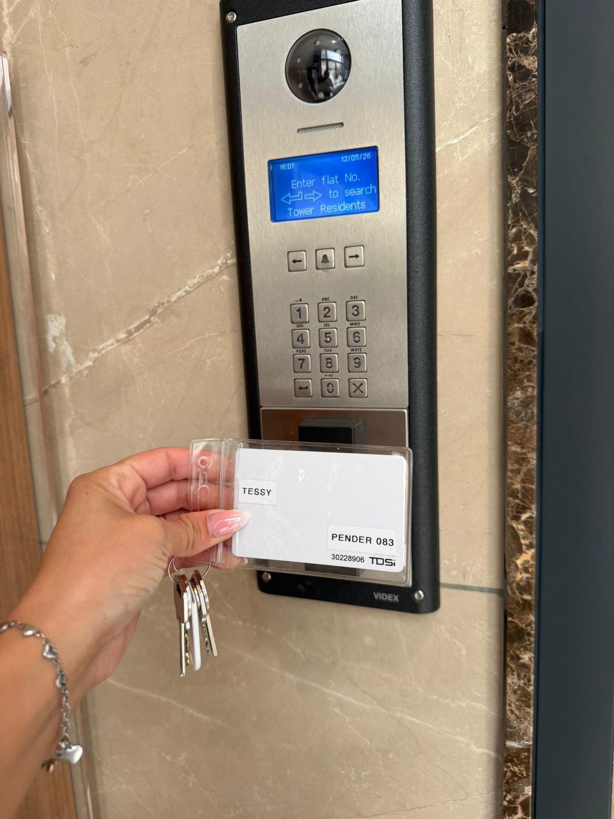 Tap key card on the intercom panel